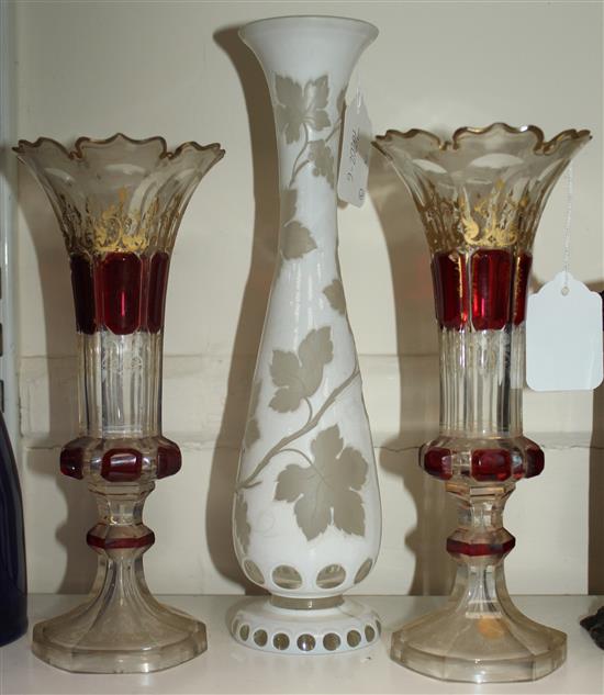 A pair of Bohemian vases and a a similar white overlaid glass, late 19th century, 23.5cm (9.25in.) & 29.5cm (